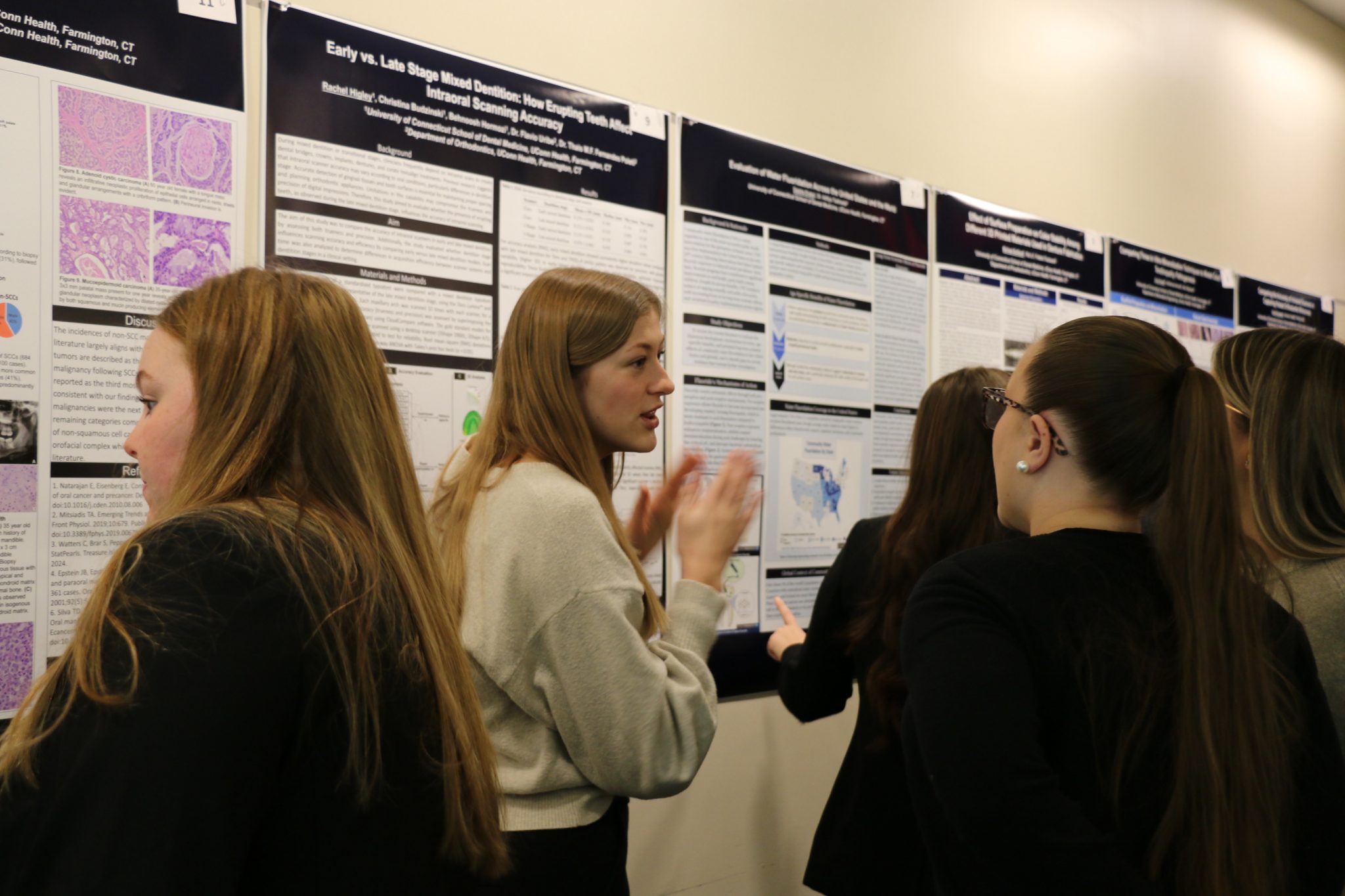 researchers infront of poster